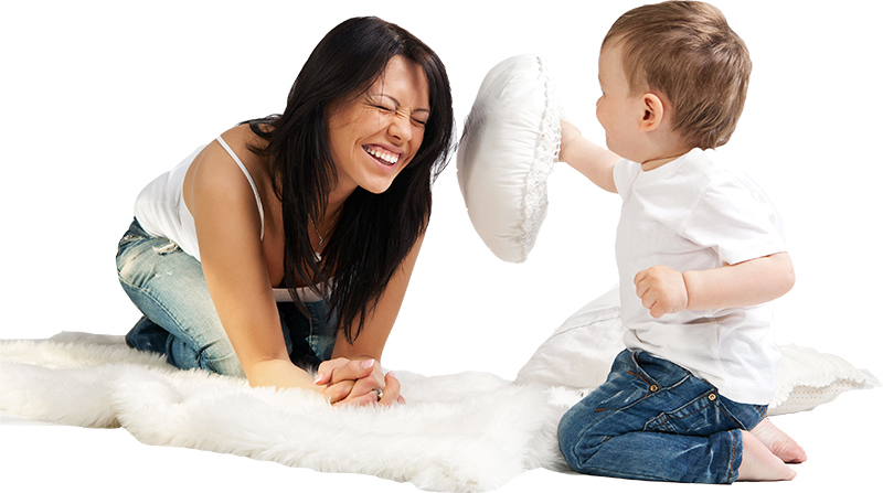 nanny and child play with pillows